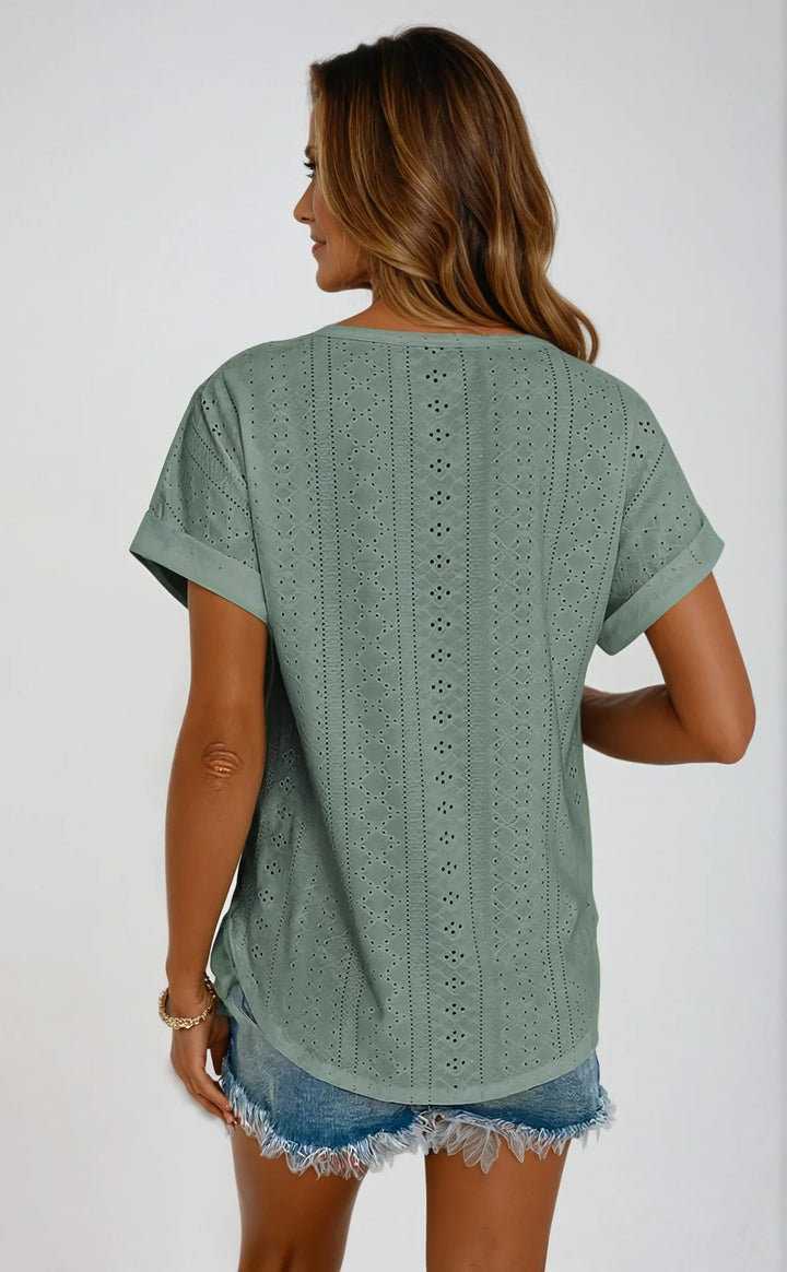 Versatile ladies' eyelet short sleeve top with a classic crew neck, ideal for warm weather.