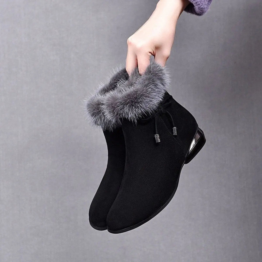 Women's cozy flat black ankle boots for ultimate winter style & comfort.