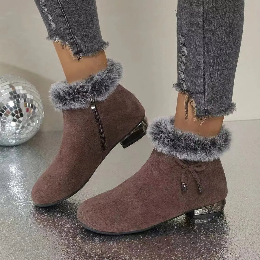 Stylish women's flat brown ankle boots, perfect for casual fall & winter fashion.