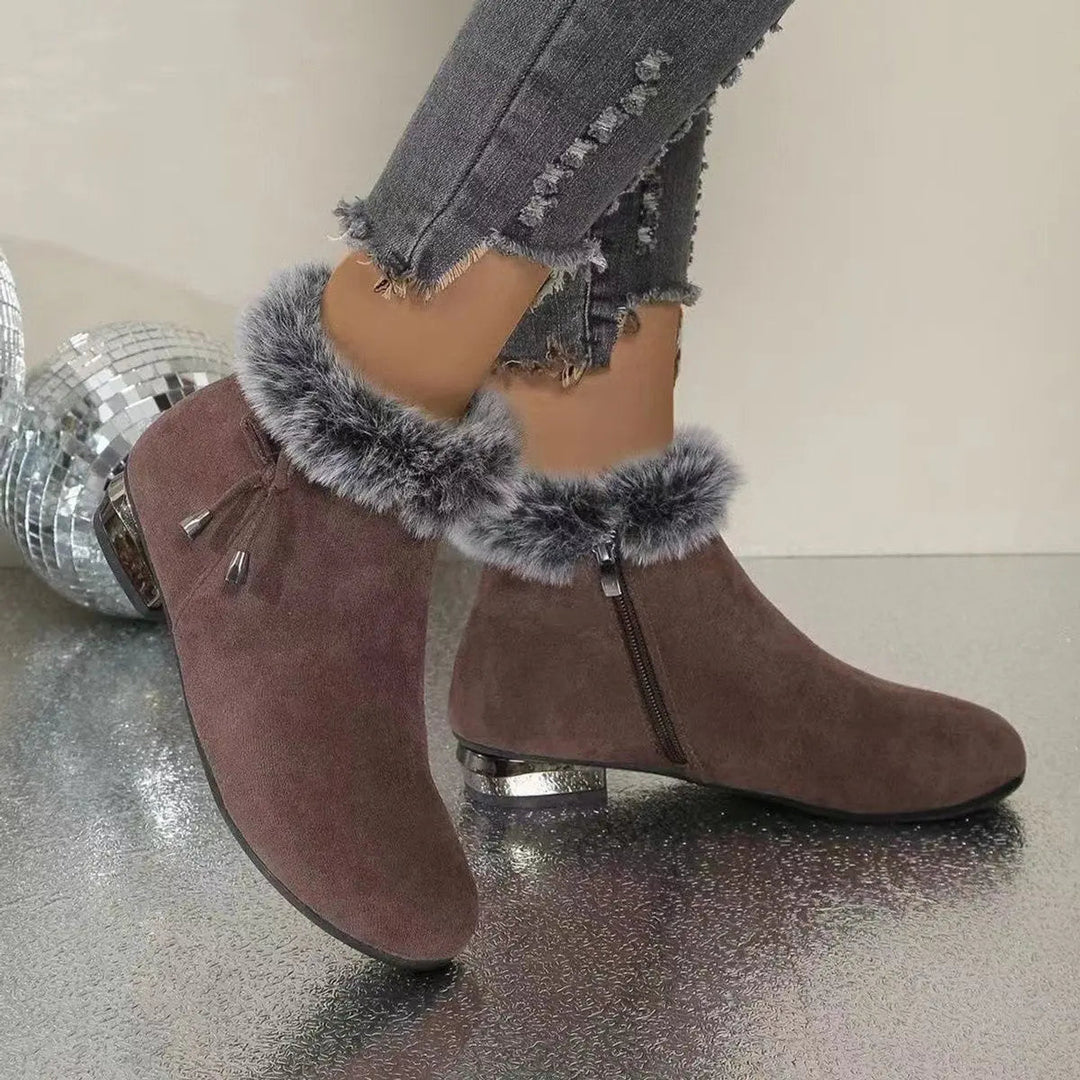 Versatile black women's flat ankle boots, great for stylish casual winter & fall outfits.