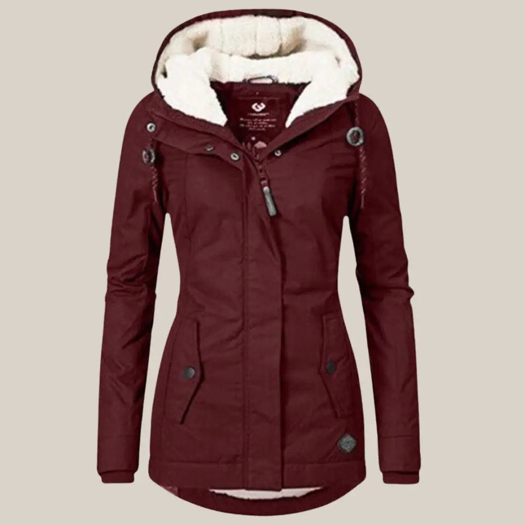 Versatile women's insulated quilted jacket with a cozy hood and fleece lining for ultimate winter comfort.
