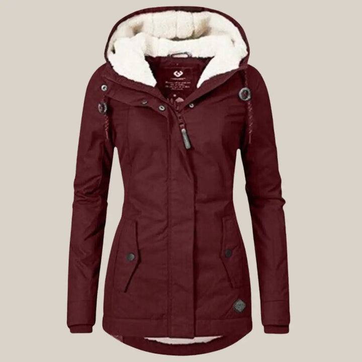 Versatile women's insulated quilted jacket with a cozy hood and fleece lining for ultimate winter comfort.