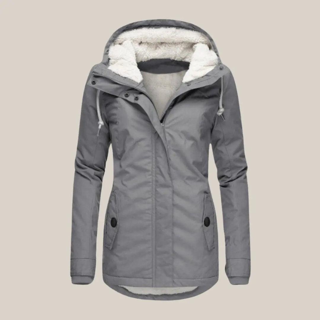 Close-up of the quilted pattern & cozy fleece-lined hood on a women's winter jacket.