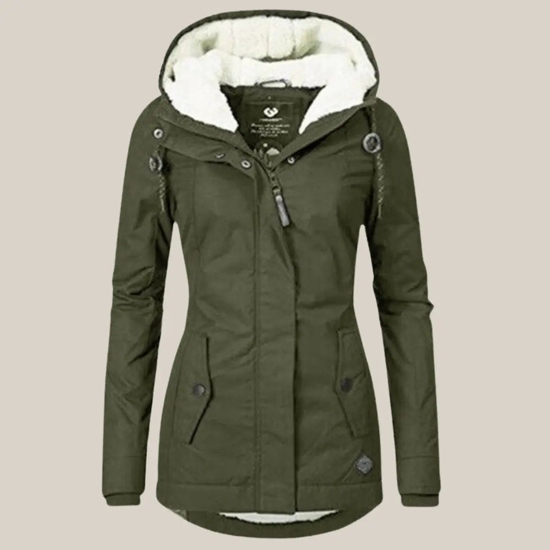 Detail of the interior fleece lining of a warm women's hooded quilted winter jacket.