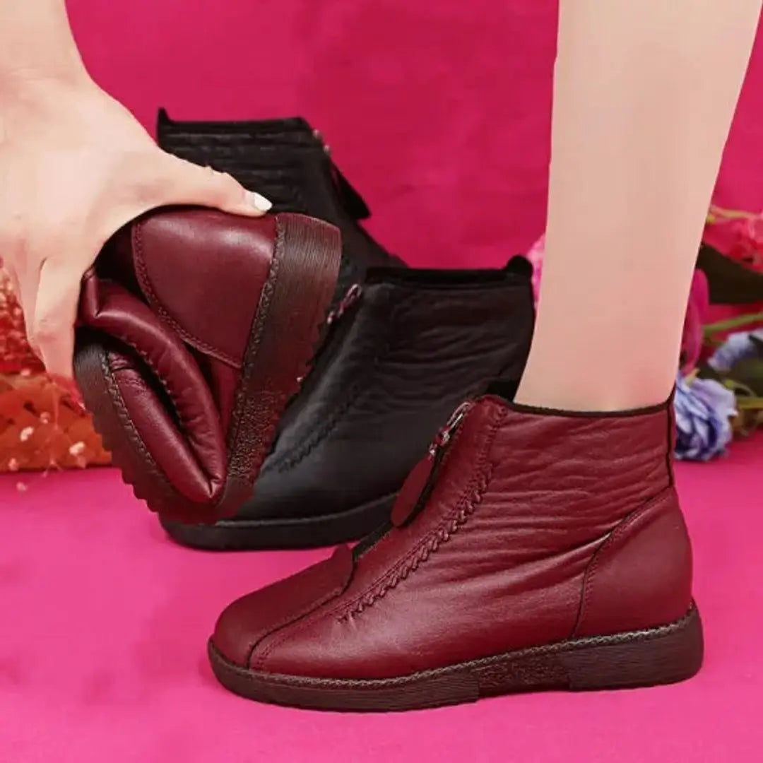 Cozy women's winter ankle boots with non-slip sole & convenient zip, ensuring warmth & grip.