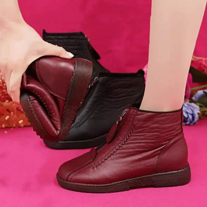 Cozy women's winter ankle boots with non-slip sole & convenient zip, ensuring warmth & grip.