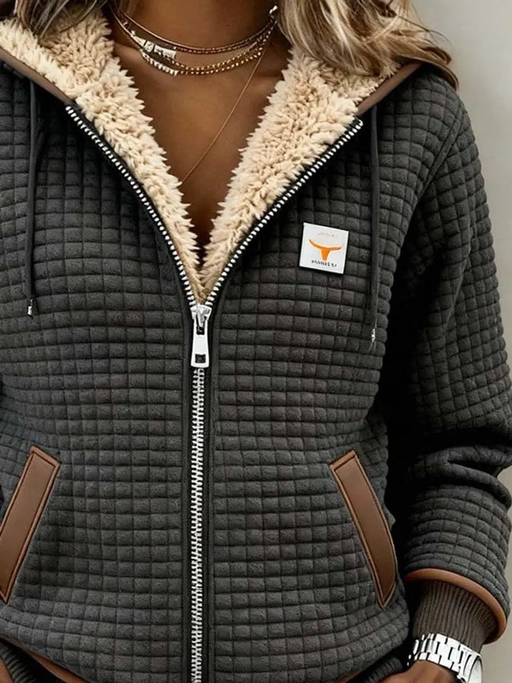 Cozy women's sherpa fleece-lined quilted zip-up hoodie, perfect warm outerwear for fall & winter fashion.