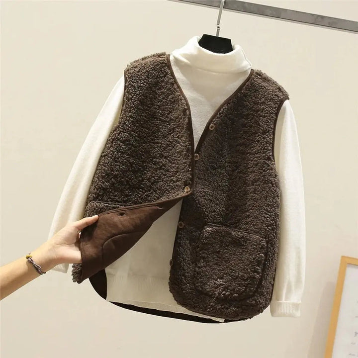Women's reversible puffer vest, button-up warm gilet. Perfect for autumn & winter layering.