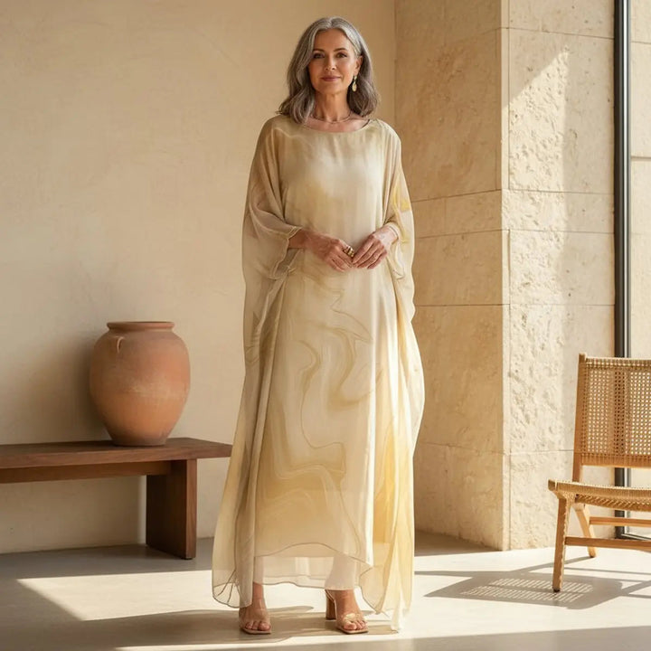 Resort fashion women's floaty maxi dress, long batwing sleeves, round neck. Great for holiday & special events.