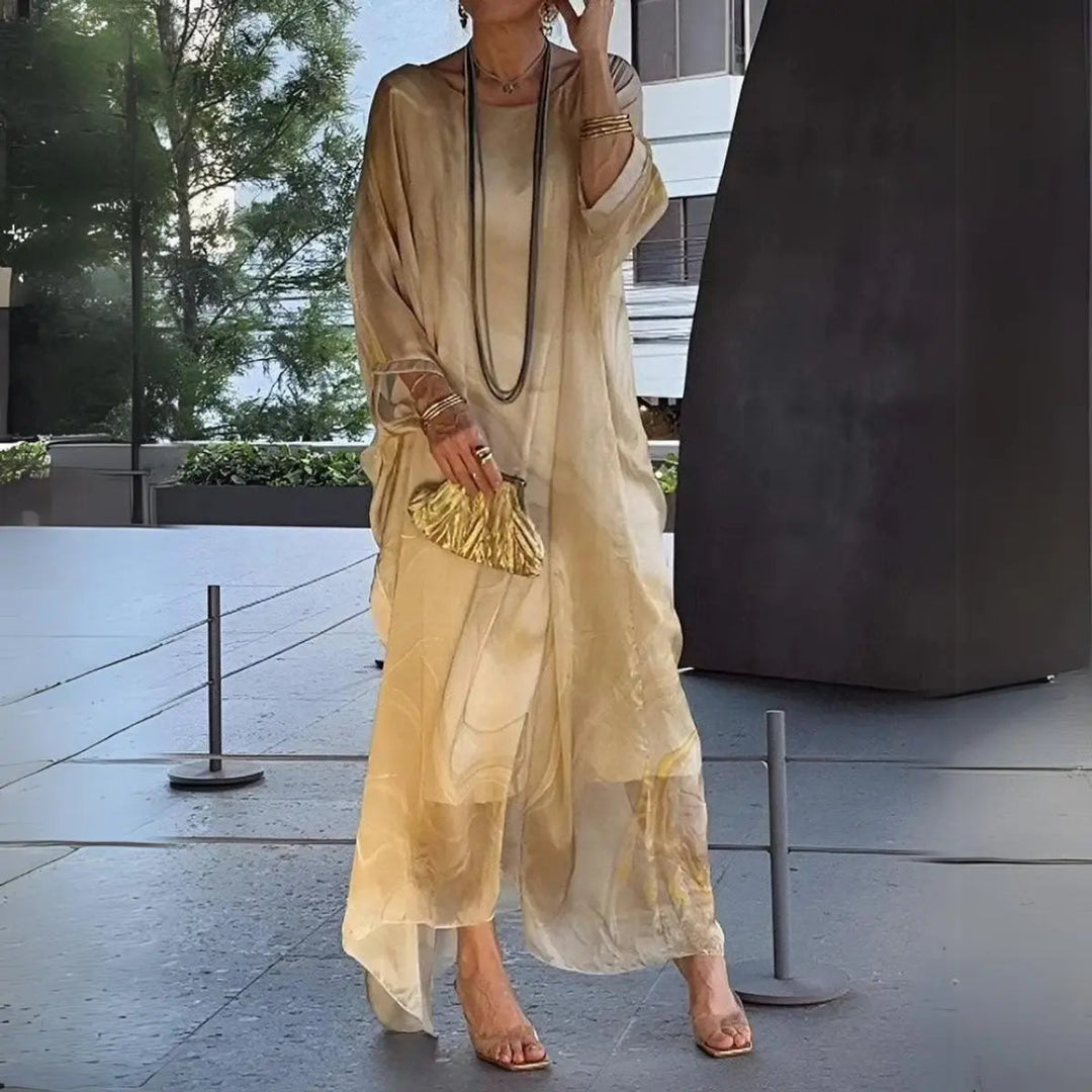Elegant women's batwing maxi dress with long sleeves & round neck. Ideal for wedding guests & evening events.