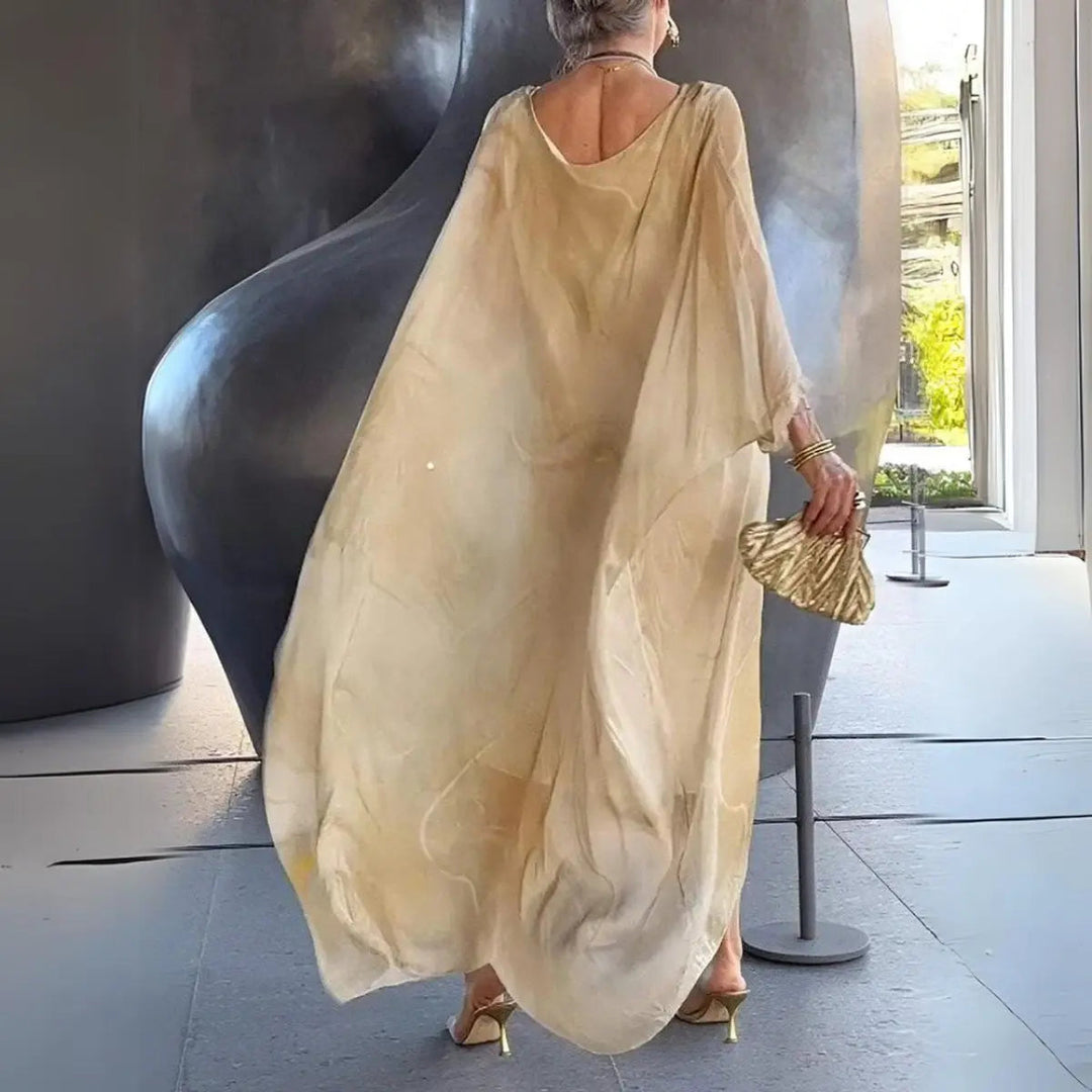 Flowy women's long sleeve maxi dress with batwing sleeves & round neck. Perfect resort & holiday occasion wear.