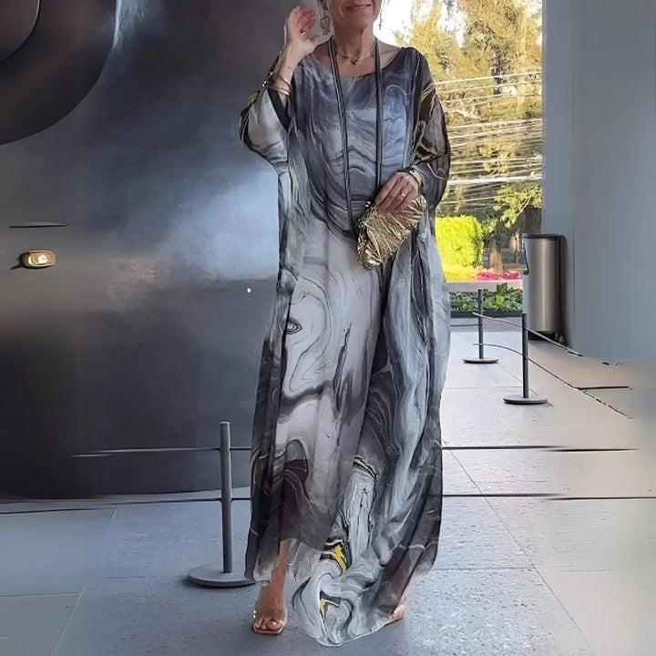 Stylish & comfy women's floaty long sleeve batwing maxi dress. Round neck, elegant for occasions & parties.
