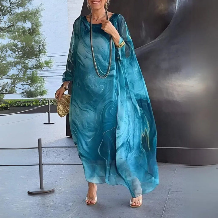Sophisticated women's floaty maxi dress, long batwing sleeves, round neck. Ideal for evening wear & daytime.