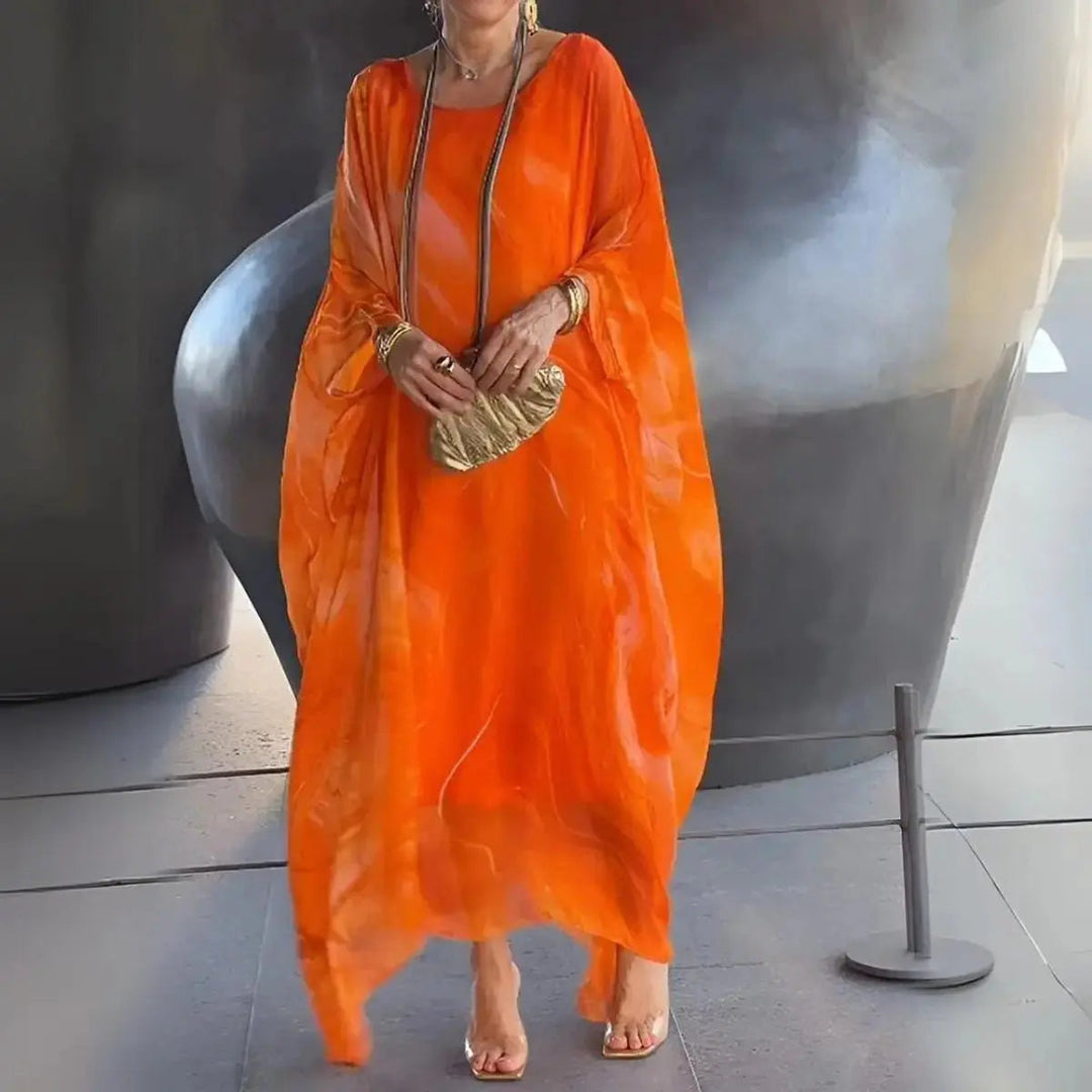 Elegant floaty maxi dress for women, long batwing sleeves, round neck. Perfect occasion & evening wear.