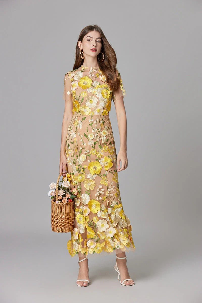 Elegant women's Scarlett maxi dress, sleeveless, with intricate floral appliques.