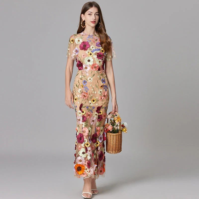 Elegant Scarlett maxi dress with intricate floral appliques. Perfect sleeveless party dress for women.