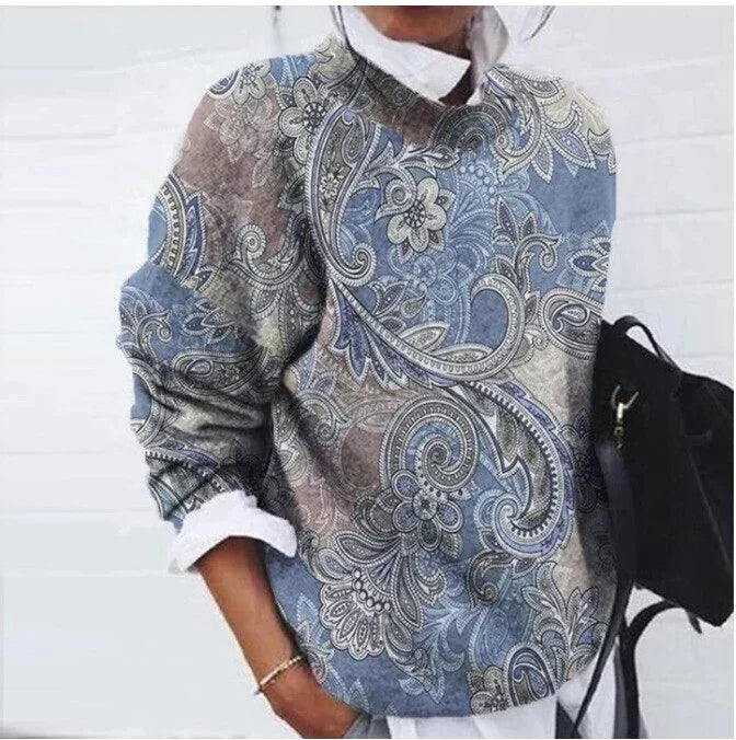 Women's floral geometric sweater with vibrant retro casual style, long sleeves, and colorful floral patterns.