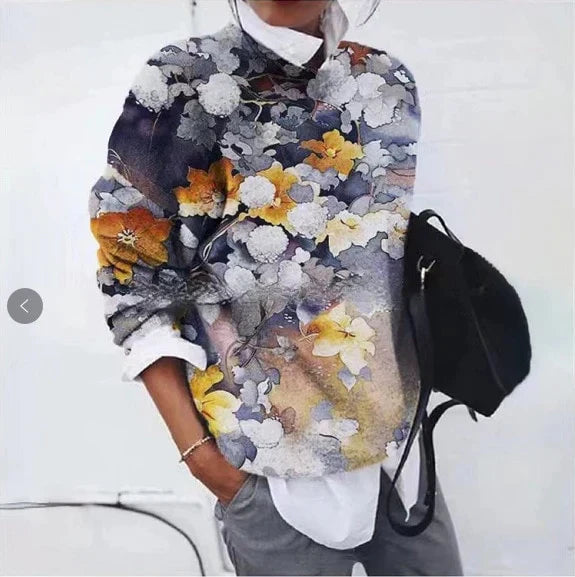 Women's floral geometric sweater with vibrant retro casual style, long sleeves, and colorful floral patterns.