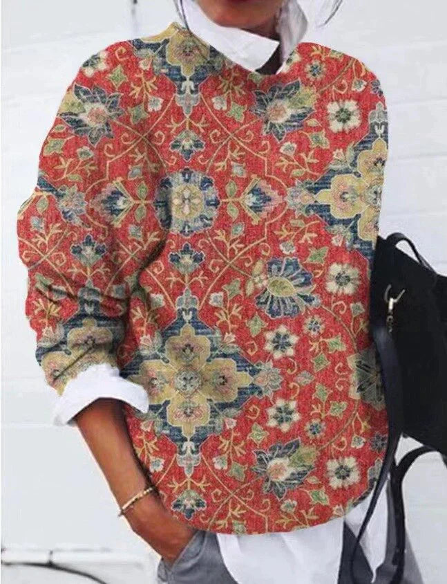 Women's floral geometric sweater with vibrant retro casual style, long sleeves, and colorful floral patterns.