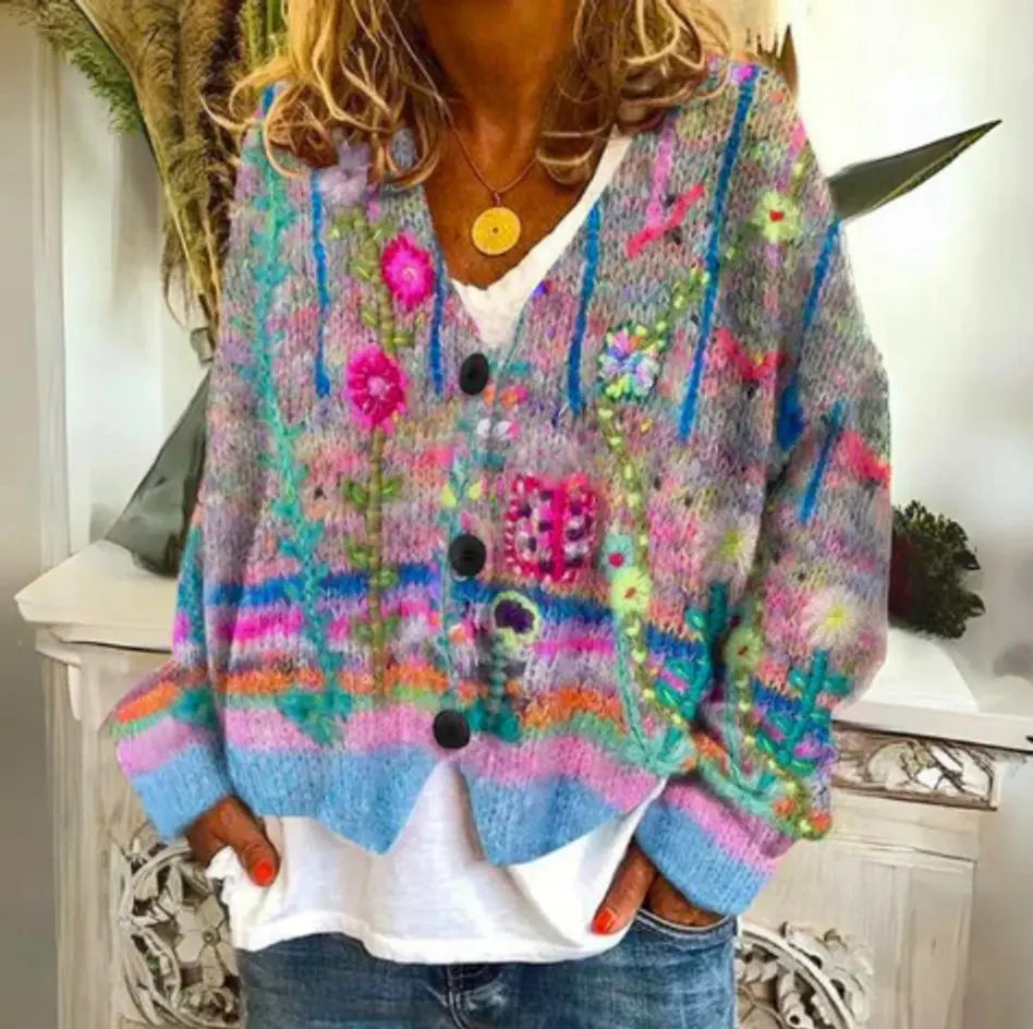Women's colorful floral knit button-up cardigan with long sleeves and v-neck, perfect for cozy fall layering.