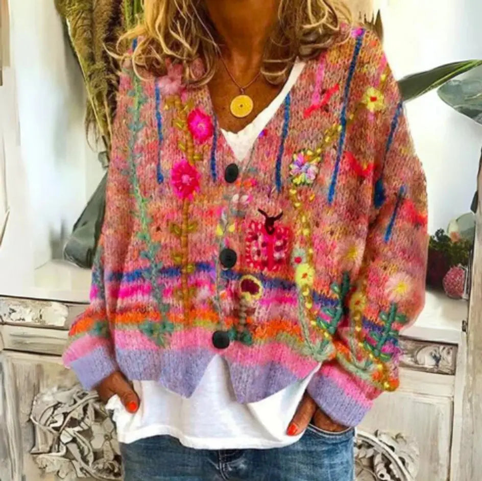 Cozy women's long sleeve floral knit cardigan with vibrant pattern and button-up front, a stylish layering top.