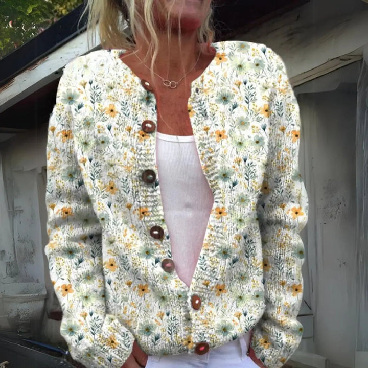 Women's floral knit button-up cardigan vest with botanical print. Perfect for autumn layering and casual wear.