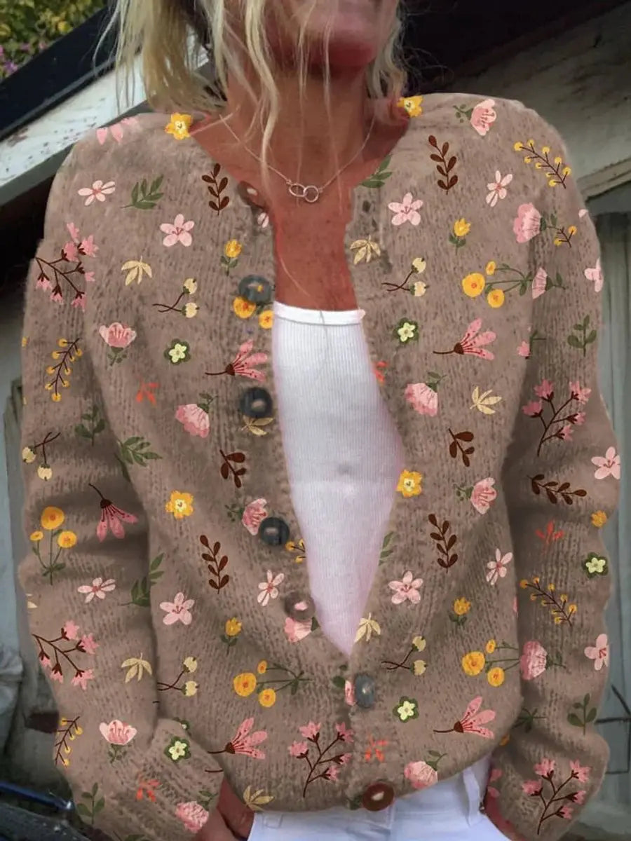 Women's button-up floral cardigan with delicate botanical print. Soft knit layering vest for stylish casual wear.