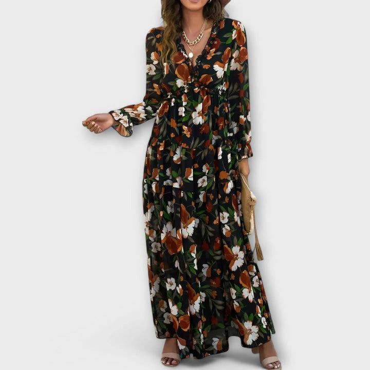 Fashionable women's floral maxi dress, designed with a trendy ruffled V-neck and a comfortable tiered skirt.