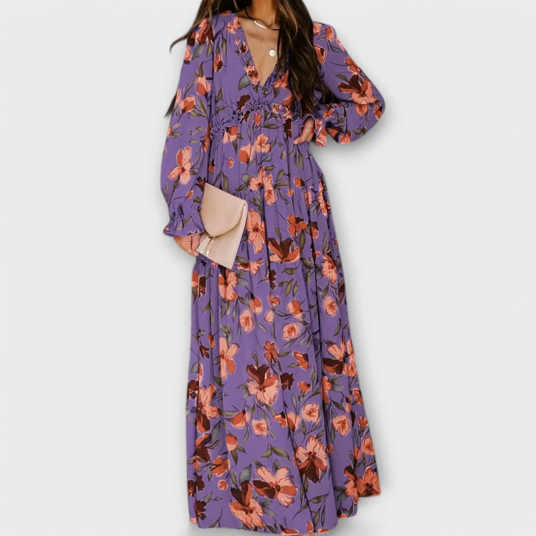 Must-have women's floral maxi dress. Ruffled V-neck and tiered skirt combine for a stunning, versatile look.