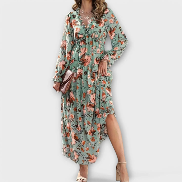 Vibrant floral maxi dress for women featuring a stylish ruffled V-neck and a flowing tiered skirt.