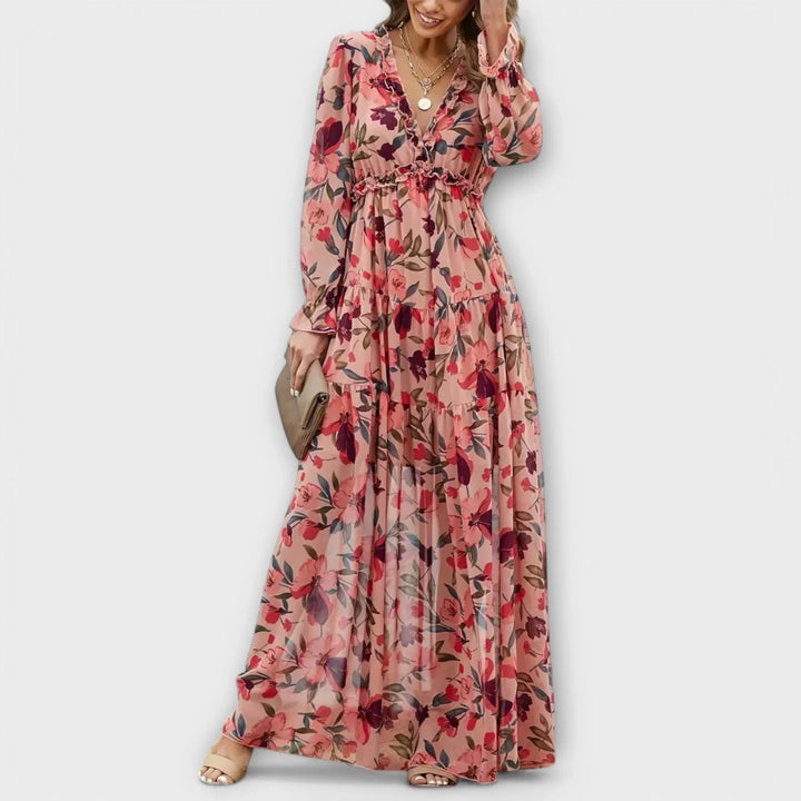 Women's Floral Maxi Dress with Ruffled V-Neck & Tiered Skirt. Elegant spring/summer fashion.