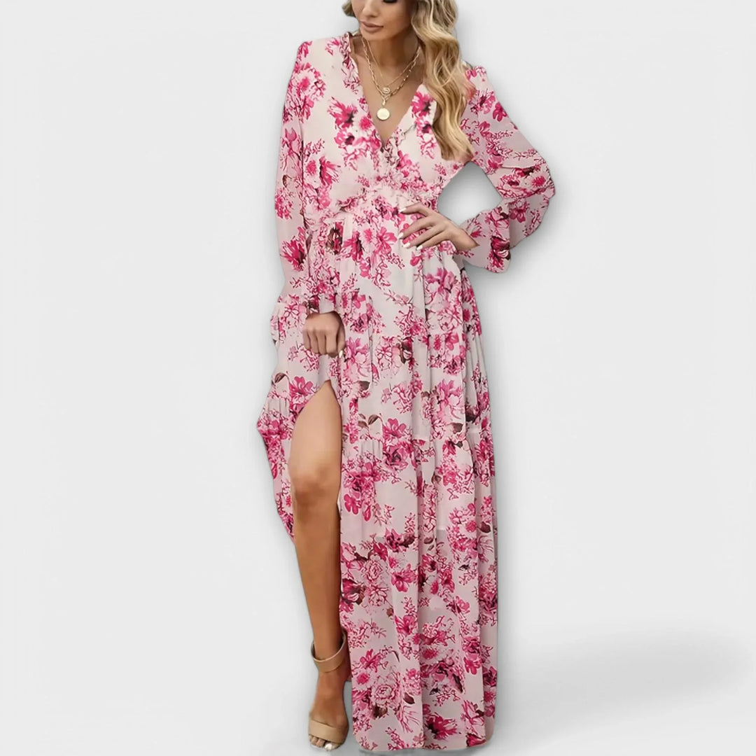 Elegant women's spring/summer floral maxi dress. Features a delicate ruffled V-neck & a voluminous tiered skirt.