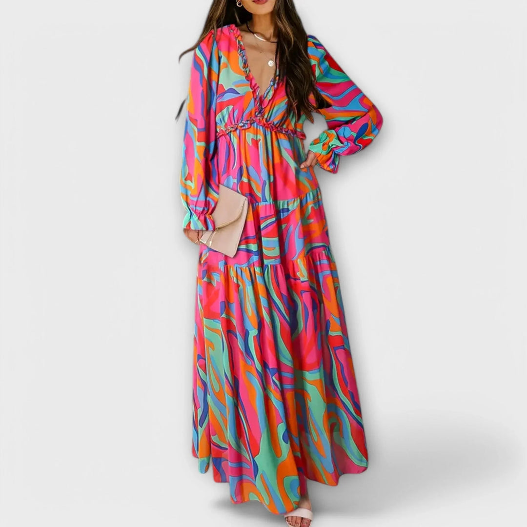 Flowy women's floral maxi dress for parties & events, highlighting a pretty ruffled V-neck & a lovely tiered skirt.