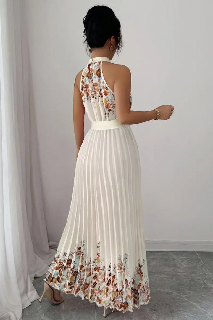 Flowing floral pleated halter-neck maxi dress for women, ideal for dancing at special events.