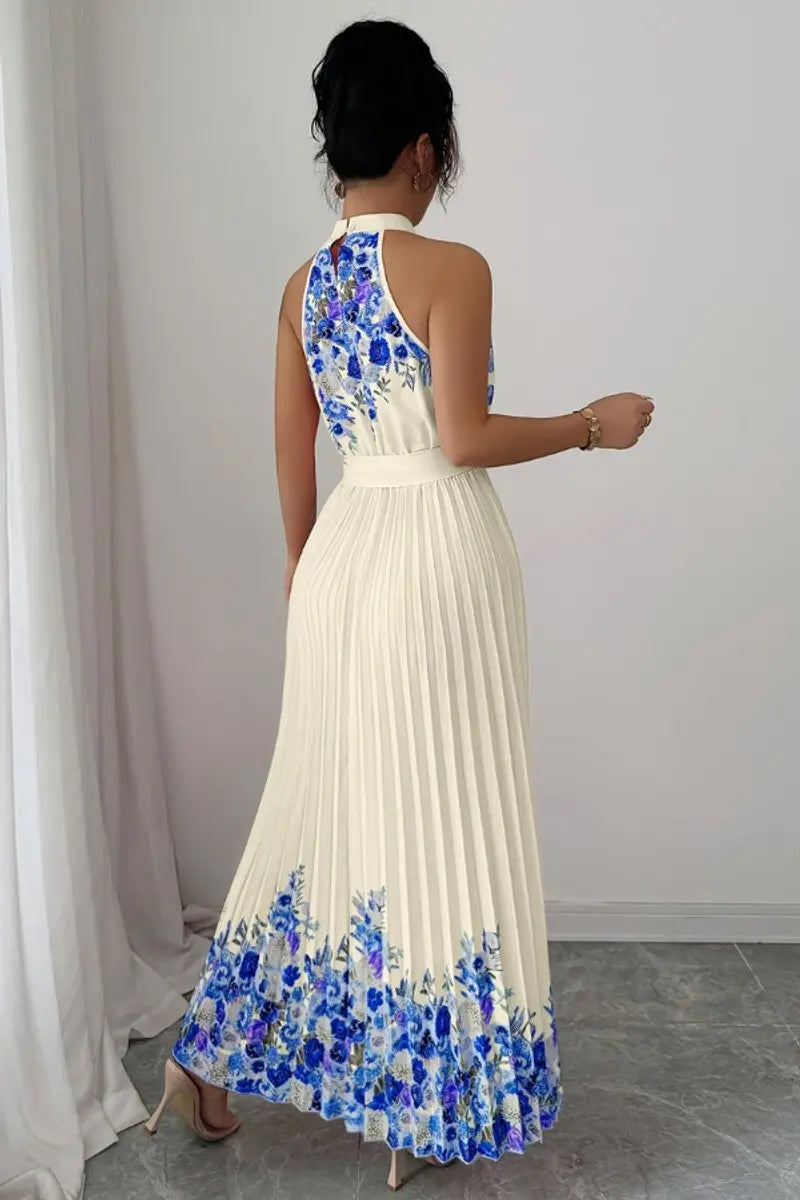 Women's floral pleated halter neck maxi evening gown. Elegant formal dress for special occasions.