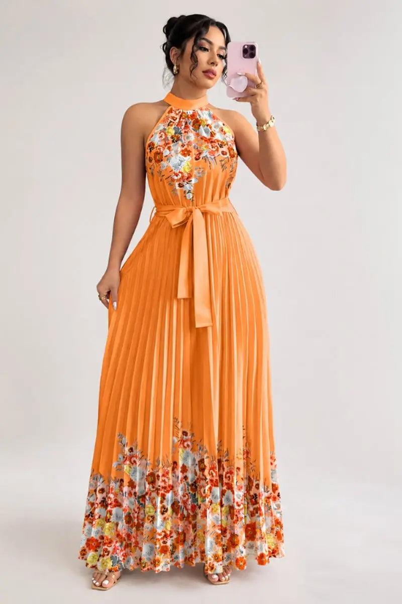 Textured pleated floral maxi dress with a sophisticated halter neck, perfect for women's events.