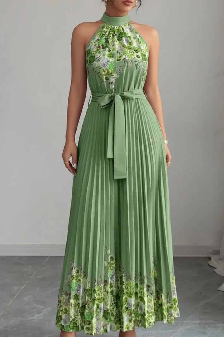 Chic women's floral pleated halter neck maxi dress, an elegant choice for any special evening.
