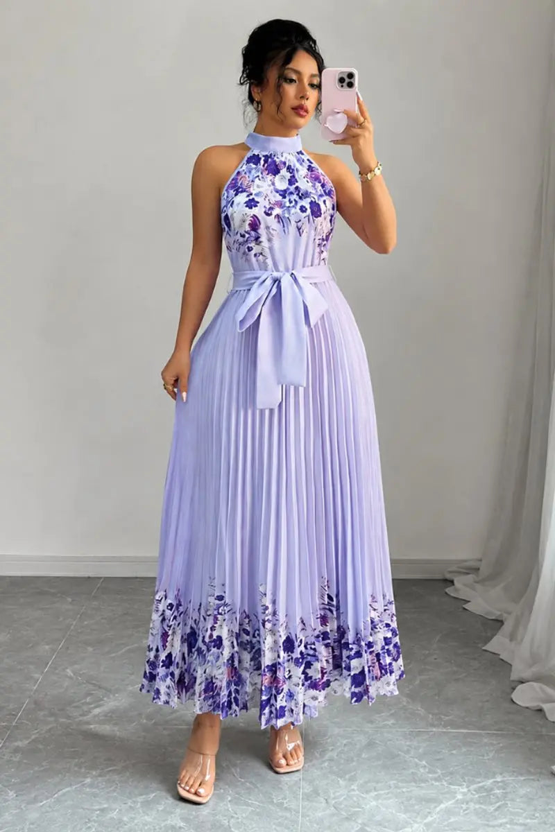 Flowy A-line floral maxi dress with pleated skirt and elegant halter neckline for women's formal events.