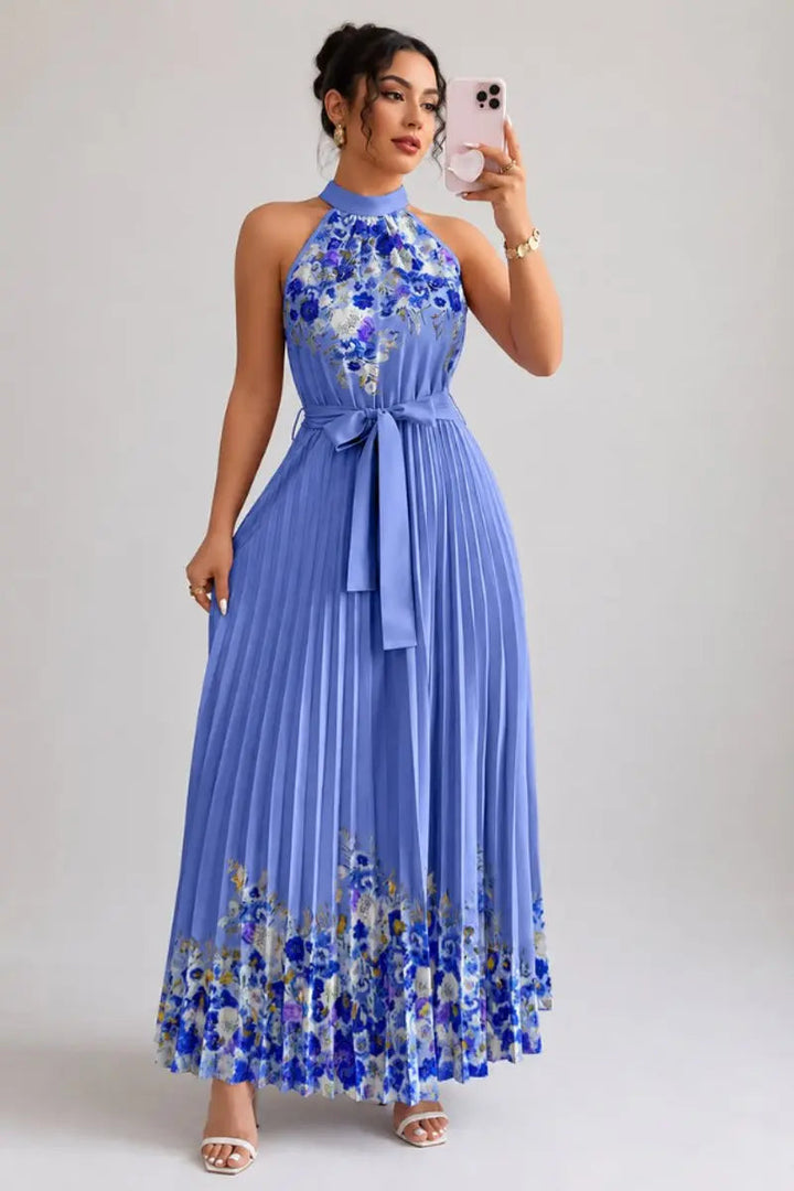 Formal women's floral halter neck evening gown with elegant pleats and maxi length.