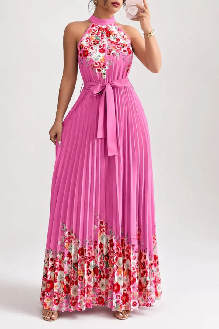 Elegant women's floral pleated halter-neck maxi gown, featuring a graceful open back design.