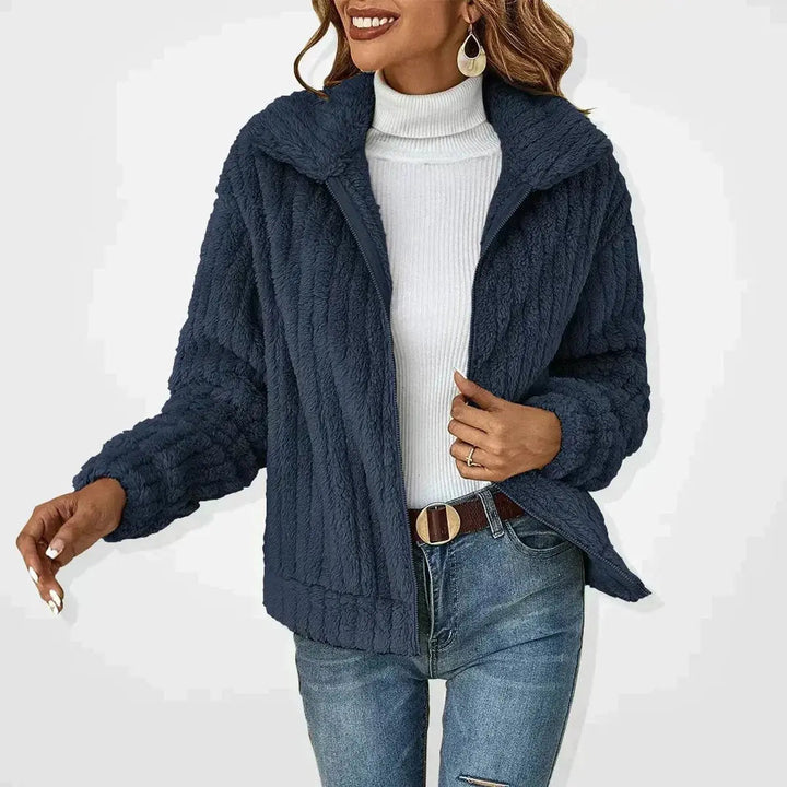 Stylish women's oversized fluffy quilted jacket with zip-up front, ideal for fashion layering.