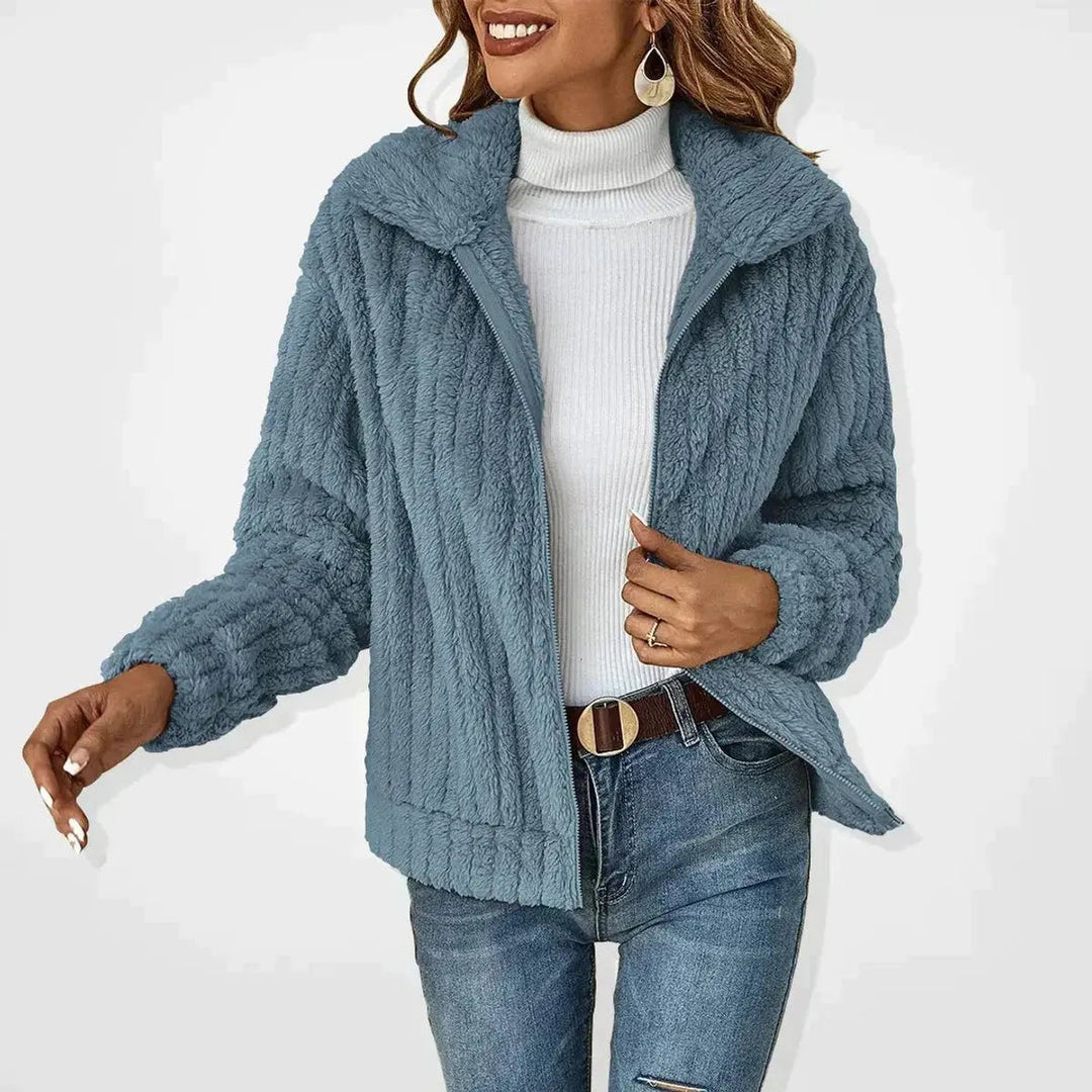 Soft fluffy women's quilted zip-up jacket, providing cozy comfort as casual outerwear for cool weather.
