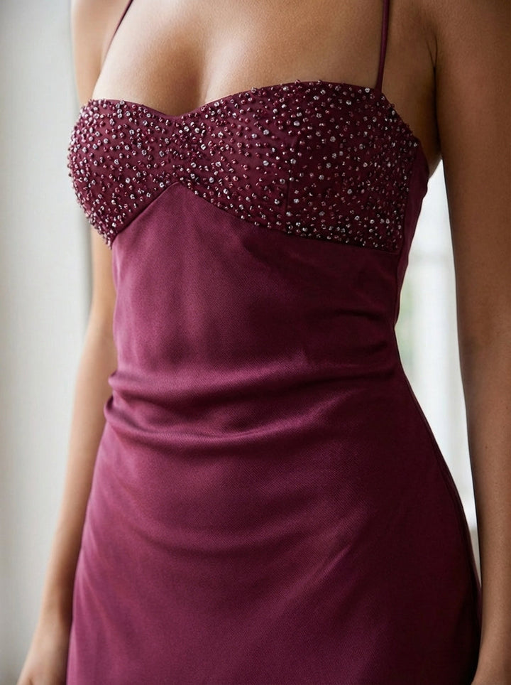 Formal women's evening gown, elegant halter neck maxi dress with pearl details for special occasions.
