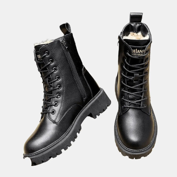 Women's black lace-up combat ankle boots with fur lining, designed with a chunky sole for stylish and warm winter wear.