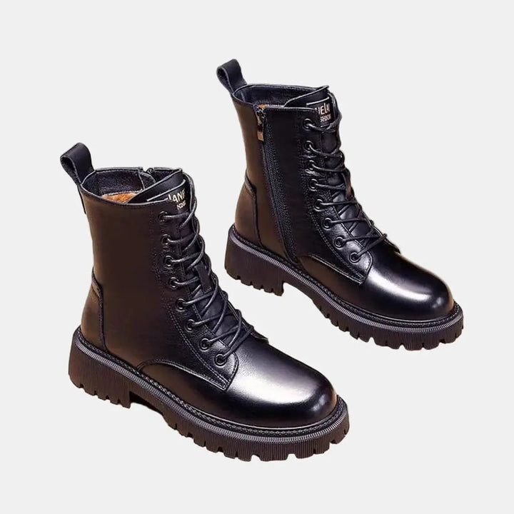 Durable black women's winter combat boots with lace-up detail, warm fur lining, and a chunky grip sole for casual wear.