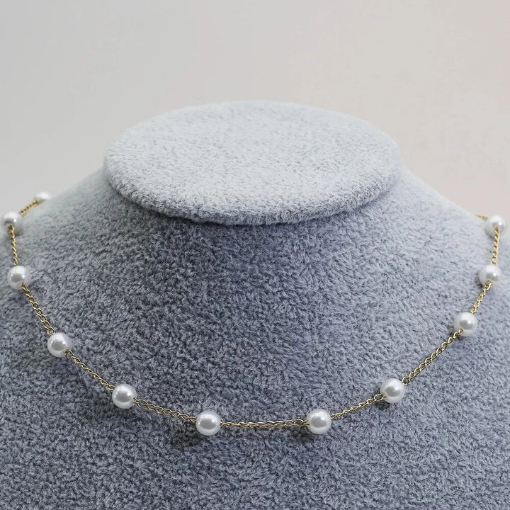 Stylish dainty gold tone pearl necklace for women. Delicate choker design, perfect for elegant wear.