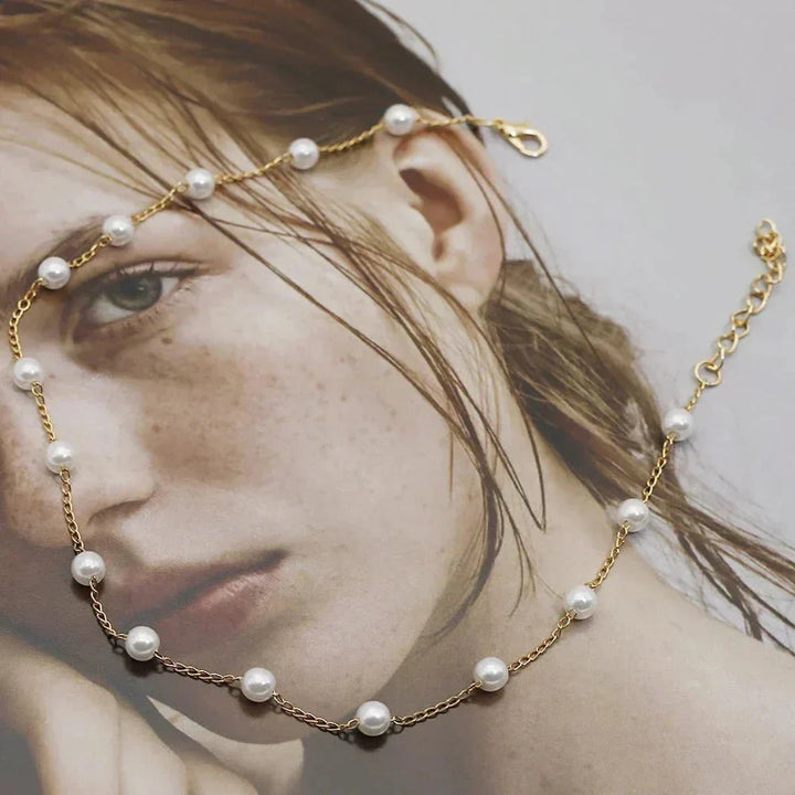 Fashionable gold tone choker with a beautiful pearl. Dainty women's necklace, ideal for gifting.