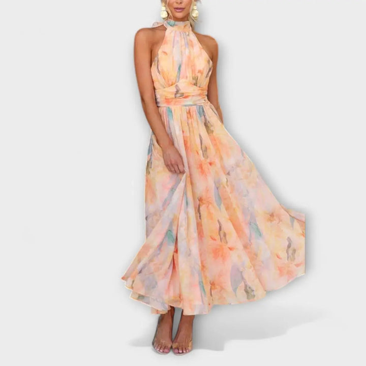 Stunning women's party dress: halterneck, maxi length, elegant watercolor print. Great for evening events.