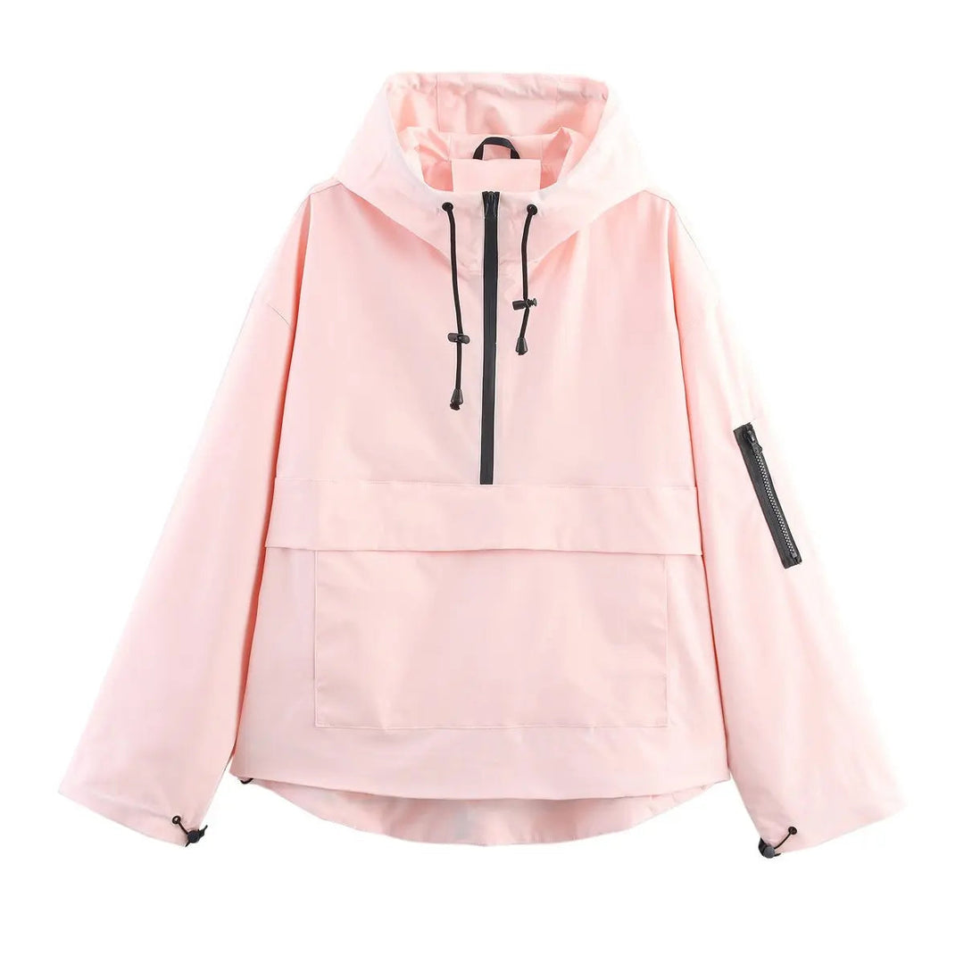 Stylish women's quilted anorak pullover. Hooded, windproof half-zip jacket, essential lightweight outerwear for spring.
