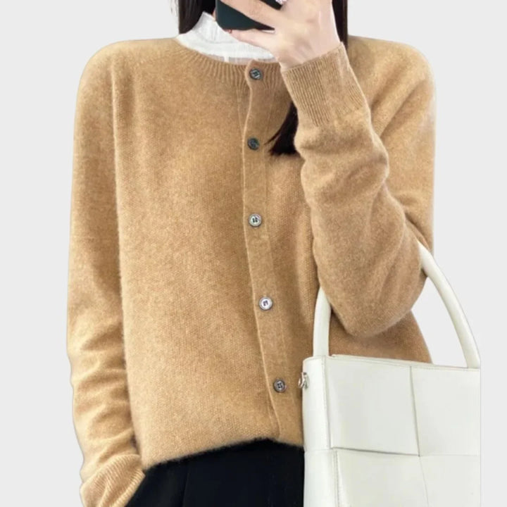 Women's long-sleeve cardigan layered over a top. Button-front crew-neck sweater for versatile outfits.